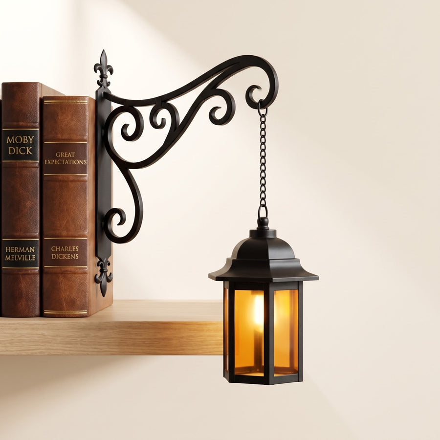 The Coach Lantern shelf lantern by NookPalace, hanging between books