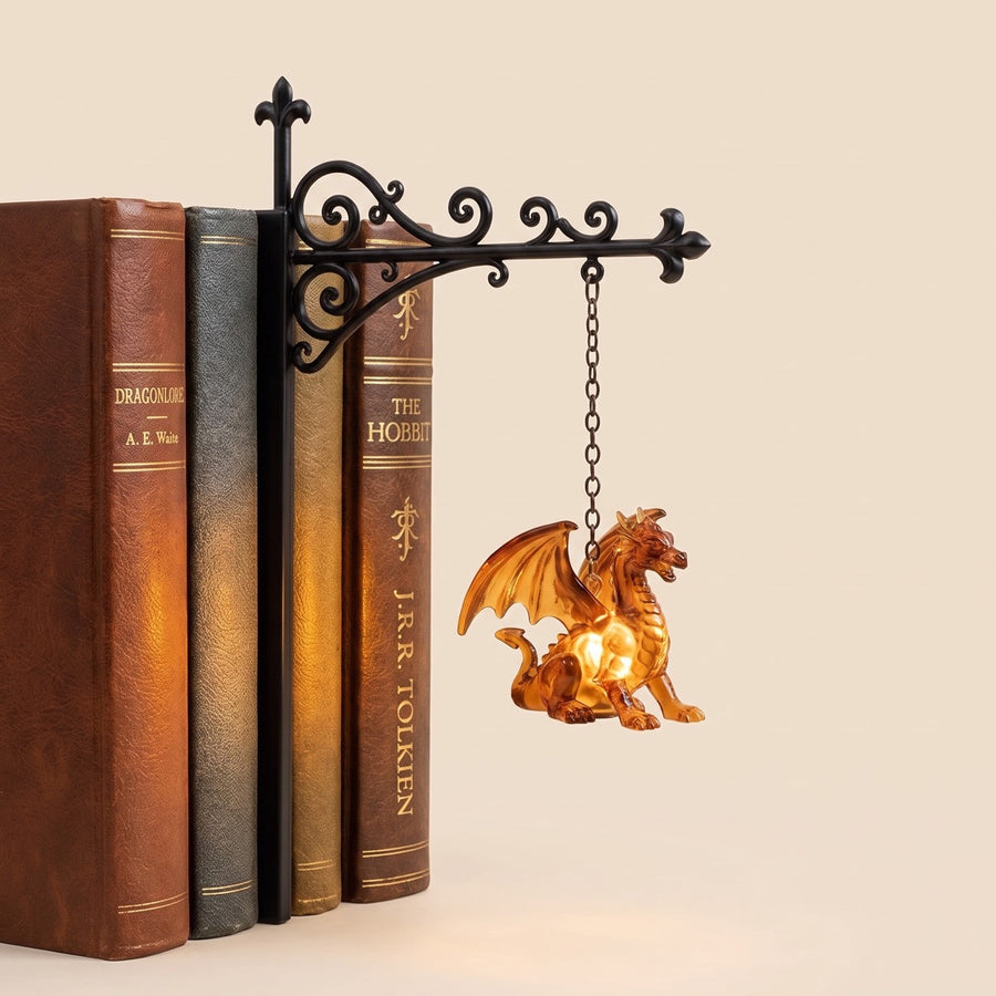 The Wyrm shelf lantern by NookPalace, hanging between books